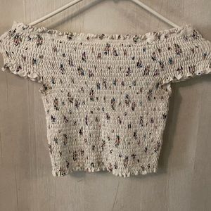 Crop top shirt. White with colored flowers. Size small/medium.